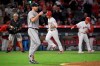 Houston Astros starting pitcher Justin Verlander, second from left, walks back to the mound after giving up a two-run home run to Los Angeles Angels' Andrelton Simmons, second from right, during the fourth inning of a baseball game Saturday, Sept. 28, 2019, in Anaheim, Calif. (AP Photo/Mark J. Terrill)