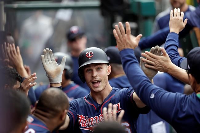 Minnesota Twins' Max Kepler, center, celebrates his two-run home run with teammates in the dugout during the seventh inning of the team's baseball game against the Los Angeles Angels on Thursday, May 23, 2019, in Anaheim, Calif. (AP Photo/Marcio Jose Sanchez)