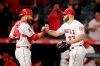 Los Angeles Angels relief pitcher Cody Allen, right, and catcher Jonathan Lucroy celebrate the team's 11-8 win over the Milwaukee Brewers in a baseball game, Tuesday, April 9, 2019, in Anaheim, Calif. (AP Photo/Jae C. Hong)