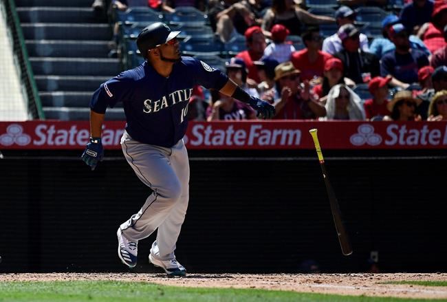 Seattle Mariners' Edwin Encarnacion drops hit bat after hitting a solo home run during the sixth inning of a baseball game against the Los Angeles Angels Sunday, June 9, 2019, in Anaheim, Calif. (AP Photo/Mark J. Terrill)