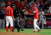 Los Angeles Angels manager Brad Ausmus right, gestures to pitcher Noe Ramirez (24) after Ramirez hit Houston Astros' Jake Marisnick with a pitch during the sixth inning of a baseball game Tuesday, July 16, 2019, in Anaheim, Calif. (AP Photo/Marcio Jose Sanchez)