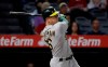 Oakland Athletics' Matt Chapman watches his two-run home run during the ninth inning of the team's baseball game against the Los Angeles Angels on Wednesday, Sept. 25, 2019, in Anaheim, Calif. (AP Photo/Marcio Jose Sanchez)