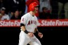 Los Angeles Angels' Tommy La Stella celebrates after scoring on a single from David Fletcher during the sixth inning of a baseball game against the New York Yankees Thursday, April 25, 2019, in Anaheim, Calif. (AP Photo/Marcio Jose Sanchez)