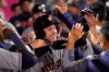 Houston Astros' Josh Reddick is congratulated by teammates in the dugout after hitting a three-run home run during the sixth inning of a baseball game against the Los Angeles Angels Saturday, Sept. 28, 2019, in Anaheim, Calif. (AP Photo/Mark J. Terrill)