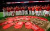 Members of the Los Angeles Angels place their jerseys with No. 45 in honor of pitcher Tyler Skaggs on the mound after a combined no-hitter against the Seattle Mariners during a baseball game Friday, July 12, 2019, in Anaheim, Calif. The Angels won 13-0. (AP Photo/Marcio Jose Sanchez)