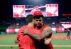 Los Angeles Angels relief pitcher Felix Pena, right, hugs starter Taylor Cole after they threw a combined-no hitter against the Seattle Mariners during a baseball game Friday, July 12, 2019, in Anaheim, Calif. The Angels won 13-0. (AP Photo/Marcio Jose Sanchez)