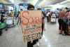 CP
A protester shows a placard to stranded travelers during a demonstration at the Airport in Hong Kong, Tuesday, Aug. 13, 2019. Protesters severely crippled operations at Hong Kong's international airport for a second day Tuesday, forcing authorities to cancel all remaining flights out of the city after demonstrators took over the terminals as part of their push for democratic reforms. (AP Photo/Kin Cheung)