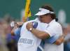 Jon Super / The Associated Press
Phil Mickelson closed with an eight-foot birdie putt and then hugged caddie Jim Mackay, whispering 'I did it.'
