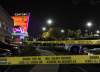 KARL GEHRING / THE ASSOCIATED PRESS 
Anxious family members gather outside the movie theatre after the shooting.