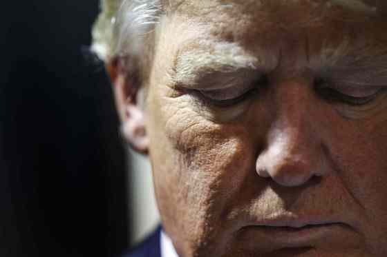 AP Photo/Cheryl SenterRepublican presidential candidate Donald Trump listens as he is introduced at Politics and Eggs in Manchester, N.H., Wednesday, Nov. 11, 2015. The event was hosted by New England Council and NH Institute of Politics.