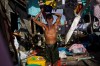 David Guttenfelder / The Associated Press
A Typhoon Haiyan survivor bathes in the ruins of his home in Guiuan, Philippines. Typhoon Haiyan, one of the most powerful storms on record, hit the country's eastern seaboard Nov. 8, leaving a wide swath of destruction.