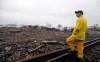 LM Otero / The Associated Press
A firefighter stands on a rail line and surveys the remains of a fertilizer plant destroyed by an explosion in West, Texas, Thursday.