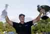 JOHN BAZEMORE / THE ASSOCIATED PRESS
Henrik Stenson has his hands full of hardware Sunday afternoon at East Lake. The Swede won both the Tour Championship and FedEx Cup.