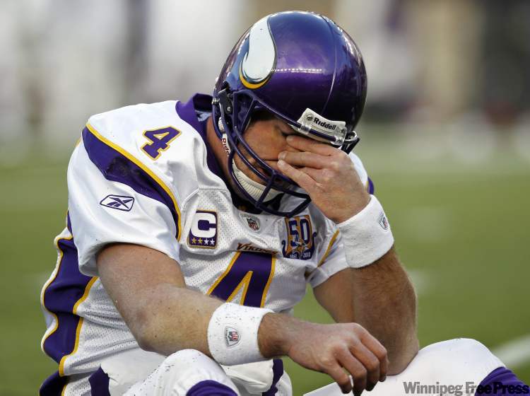 WINSLOW TOWNSON / THE ASSOCIATED PRESS ARCHIVES
Minnesota Vikings quarterback Brett Favre rubs his eyes after being hit by New England Patriots linebacker Gary Guyton during the first quarter last Sunday.