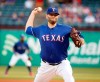 Texas Rangers starting pitcher Lance Lynn (35) throws against the Los Angeles Angels during the first inning of a baseball game Wednesday, April 17, 2019, in Arlington, Texas. (AP Photo/Michael Ainsworth)
