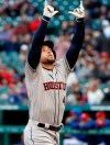 Houston Astros' George Springer (4) celebrates his lead-off solo home run in the first inning of a baseball game that came off of Texas Rangers starting pitcher Drew Smyly in Arlington, Texas, Monday, April 1, 2019. (AP Photo/Tony Gutierrez)