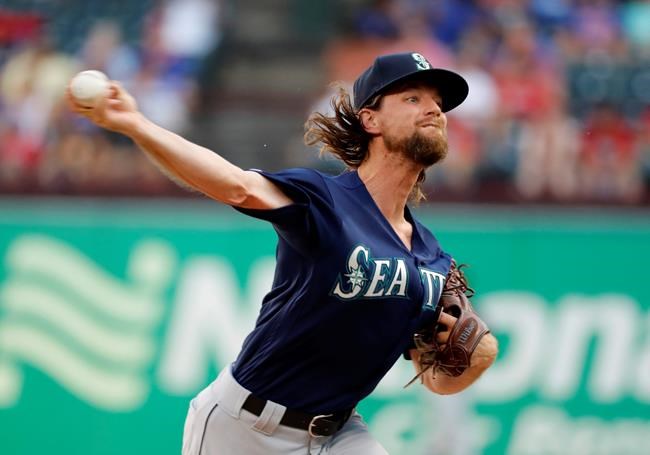 Seattle Mariners starting pitcher Mike Leake throws to the Texas Rangers in the first inning of a baseball game in Arlington, Texas, Tuesday, July 30, 2019. (AP Photo/Tony Gutierrez)