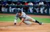 New York Yankees' Aaron Judge (99) slides into home on a sacrifice fly RBI hit by Brett Gardner during the first inning of a baseball game against the Texas Rangers, Saturday, Sept. 28, 2019, in Arlington, Texas. (AP Photo/Brandon Wade)