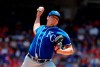 Kansas City Royals' Brad Keller throws to the Texas Rangers in the first inning of a baseball game in Arlington, Texas, Sunday, June 2, 2019. (AP Photo/Tony Gutierrez)