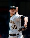 Pittsburgh Pirates starting pitcher Jameson Taillon delivers against the Texas Rangers during the first inning of a baseball game Wednesday May 1, 2019, in Arlington, Texas. (AP Photo/Mike Stone)