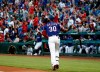 Texas Rangers' Nomar Mazara drops the bat as he runs toward first while watching his solo home run during the first inning of the team's baseball game against the Toronto Blue Jays in Arlington, Texas, Saturday, May 4, 2019. (AP Photo/Tony Gutierrez)