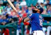 Texas Rangers' Rougned Odor follows through on an RBI double in the first inning of the team's baseball game against the Seattle Mariners in Arlington, Texas, Wednesday, July 31, 2019. (AP Photo/Tony Gutierrez)