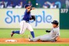 Texas Rangers second baseman Rougned Odor (12) throws to first after forcing out Tampa Bay Rays' Ji-Man Choi during the second inning of a baseball game Tuesday, Sept. 10, 2019, in Arlington, Texas. Willy Adames was safe at first. (AP Photo/Richard W. Rodriguez)