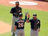 Oakland Athletics Matt Chapman (26) greets Robbie Grossman (8) and Marcus Semien (10) after Semien's two-run home run in the third against the Texas Rangers in a baseball game Sunday, Sept. 15, 2019, in Arlington, Texas. (AP Photo/Richard W. Rodriguez)