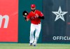Texas Rangers' Nomar Mazara fields a run-scoring single by Los Angeles Angels' Kole Calhoun in the first inning of baseball game in Arlington, Texas, Monday, Aug. 19, 2019. Shohei Ohtani scored on the hit. (AP Photo/Tony Gutierrez)