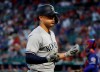 New York Yankees' Giancarlo Stanton celebrates his solo home run against the Texas Rangers in the first inning of a baseball game in Arlington, Texas, Friday, Sept. 27, 2019. (AP Photo/Tony Gutierrez)