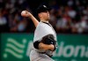 New York Yankees starting pitcher James Paxton throws to the Texas Rangers i the first inning of a baseball game in Arlington, Texas, Friday, Sept. 27, 2019. (AP Photo/Tony Gutierrez)