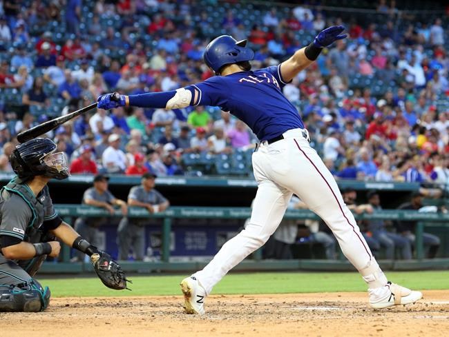 Texas Rangers Joey Gallo (13) follows through on a solo home run in the fourth inning of a baseball game against the Arizona Diamondbacks Tuesday, July 16, 2019 in Arlington, Texas. (AP Photo/Richard W. Rodriguez)