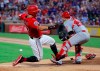 Texas Rangers' Shin-Soo Choo, left, slides ahead of the throw to Los Angeles Angels' Jonathan Lucro during the fourth inning of a baseball game in Arlington, Texas, Thursday, July 4, 2019. Choo scored on a single by Danny Santana. (AP Photo/Tony Gutierrez)