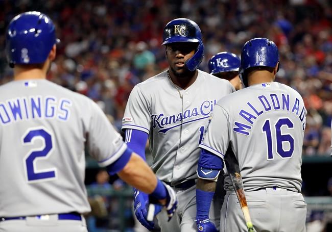 Kansas City Royals' Chris Owings (2) and Martin Maldonado (16) congratulate Jorge Soler, center, on his three-run home run against the Texas Rangers during the sixth inning of a baseball game in Arlington, Texas, Thursday, May 30, 2019. (AP Photo/Tony Gutierrez)