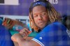 Toronto Blue Jays rookie Vladimir Guerrero Jr. looks on in the dugout during a baseball game against the Texas Rangers in Arlington, Texas, Sunday, May 5, 2019. (AP Photo/ Louis DeLuca)