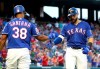 Texas Rangers' Danny Santana (38) celebrates the solo home run by Joey Gallo (13) during the fourth inning of the team's baseball game against the Arizona Diamondbacks Tuesday, July 16, 2019, in Arlington, Texas. (AP Photo/Richard W. Rodriguez)
