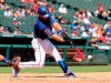 Texas Rangers' Jeff Mathis hits a two-run single in the third inning of a baseball game against the Minnesota Twins, Sunday, Aug. 18, 2019, in Arlington, Texas. (AP Photo/Richard W. Rodriguez)
