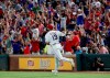 Fans cheer as Texas Rangers' Joey Gallo (13) rounds the bases after hitting a grand slam off Kansas City Royals starting pitcher Danny Duffy during the sixth inning of a baseball game in Arlington, Texas, Friday, May 31, 2019. (AP Photo/Tony Gutierrez)