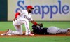 Texas Rangers shortstop Elvis Andrus (1) reaches down to apply the tag on Seattle Mariners' Dylan Moore who was caught stealing second in the fourth inning of a baseball game in Arlington, Texas, Saturday Aug. 31, 2019. (AP Photo/Tony Gutierrez)