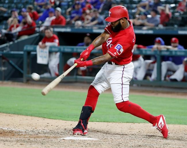 Texas Rangers' Danny Santana connects for a solo home run off Cleveland Indians reliever Adam Cimber during the ninth inning of a baseball game in Arlington, Texas, Wednesday, June 19, 2019. The Indians won 10-4. (AP Photo/Tony Gutierrez)