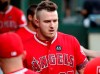 A black patch with the number 45 on it sits above the team logo as Los Angeles Angels' Mike Trout walks through the dugout in the first inning of a baseball game in Arlington, Texas, Tuesday, July 2, 2019. The entire team and staff wore the same patch honoring Tyler Skaggs. (AP Photo/Tony Gutierrez)
