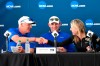 Ryan Colton, NCAA Division I Women's Golf Committee chair, center, watches as Duke women's golf coach Dan Brooks, left, shakes hands with Wake Forest women's golf coach Kim Lewellen after completing the parings for the final round of an NCAA college golf tournament, Wednesday, May 23, 2019, in Fayetteville, Ark. (AP Photo/Michael Woods)