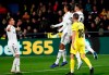 Real Madrid's Raphael Varane, second right, celebrates with teammates Sergio Ramos, right, and Lucas Vazquez after scoring against Villarreal during a Spanish La Liga soccer match at the Ceramica stadium in Villarreal, Spain, on Thursday, Jan. 3, 2019.(AP Photo/Alberto Saiz)