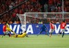 Egypt's Mahmoud Hassan, left, scores during the group A soccer match between Egypt and Zimbabwe at the Africa Cup of Nations at Cairo International Stadium in Cairo, Egypt, Friday, June 21, 2019. Egypt won 1-0. (AP Photo/Ariel Schalit)