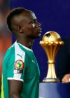 Senegal's Sadio Mane walks past the Cup after the African Cup of Nations final soccer match between Algeria and Senegal in Cairo International stadium in Cairo, Egypt, Friday, July 19, 2019. Algeria won 1-0. (AP Photo/Ariel Schalit)