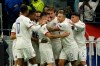 Lyon's Joachim Andersen, centre, celebrates his opening goal with teammates during the group G Champions League soccer match between Lyon and Benfica at the Lyon Olympic Stadium in Decines, outside Lyon, France, Tuesday, Nov. 5, 2019. (AP Photo/Laurent Cipriani)