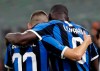 Inter Milan's Romelu Lukaku, right, celebrates his goal with Inter Milan's Marcelo Brozovic during a Serie A soccer match between AC Milan and Inter Milan, at the San Siro stadium in Milan, Italy, Saturday, Sept.21, 2019. (AP Photo/Luca Bruno)