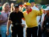 Jack Nicklaus and Gary Player acknowledge the crowd before hitting ceremonial tee shots on the first hole during the first round for the Masters golf tournament Thursday, April 11, 2019, in Augusta, Ga. (AP Photo/Matt Slocum)