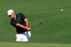 Patrick Reed hits a chip shot on the second hole during a practice round for the Masters golf tournament Wednesday, April 10, 2019, in Augusta, Ga. (AP Photo/Charlie Riedel)