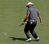 Tiger Woods reacts as he misses a birdie on the second green during the first round the Masters golf tournament Thursday, April 5, 2012, in Augusta, Ga. (AP Photo/David J. Phillip)